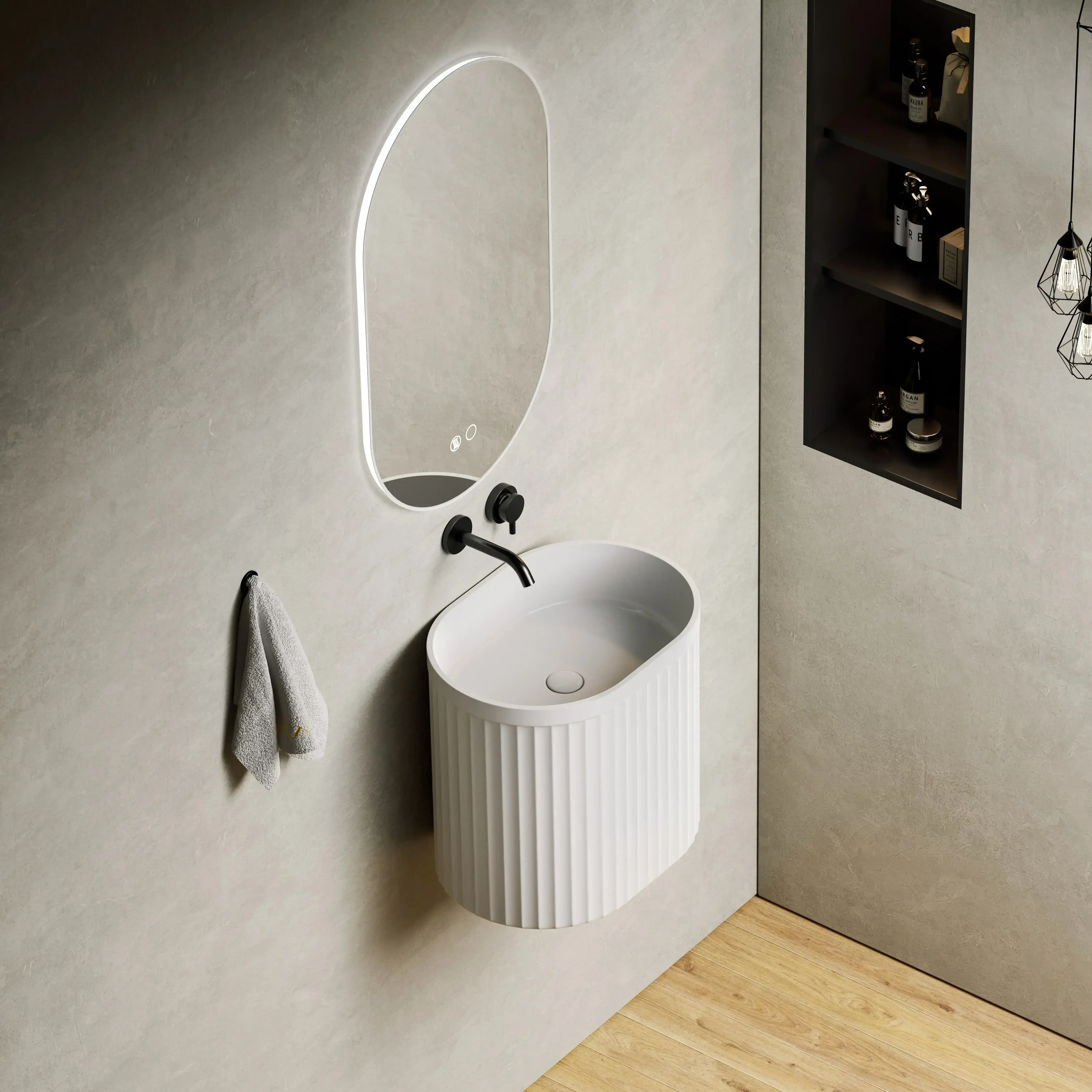 Lave-mains suspendu design forme ovale avec texture cannelée blanche et robinetterie murale noire dans un WC moderne.