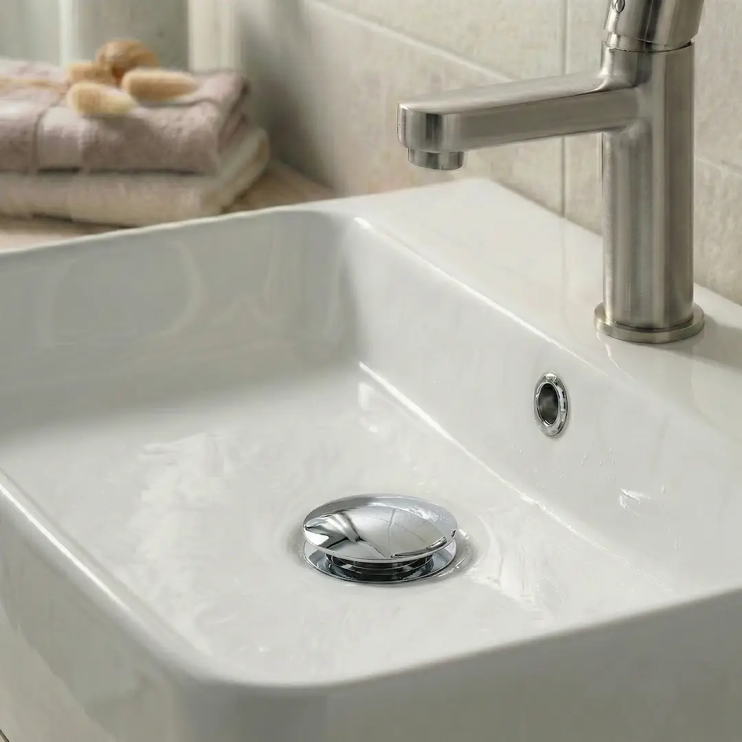 Bonde de lavabo universelle clic-clac en inox, finition chrome brillant miroir.