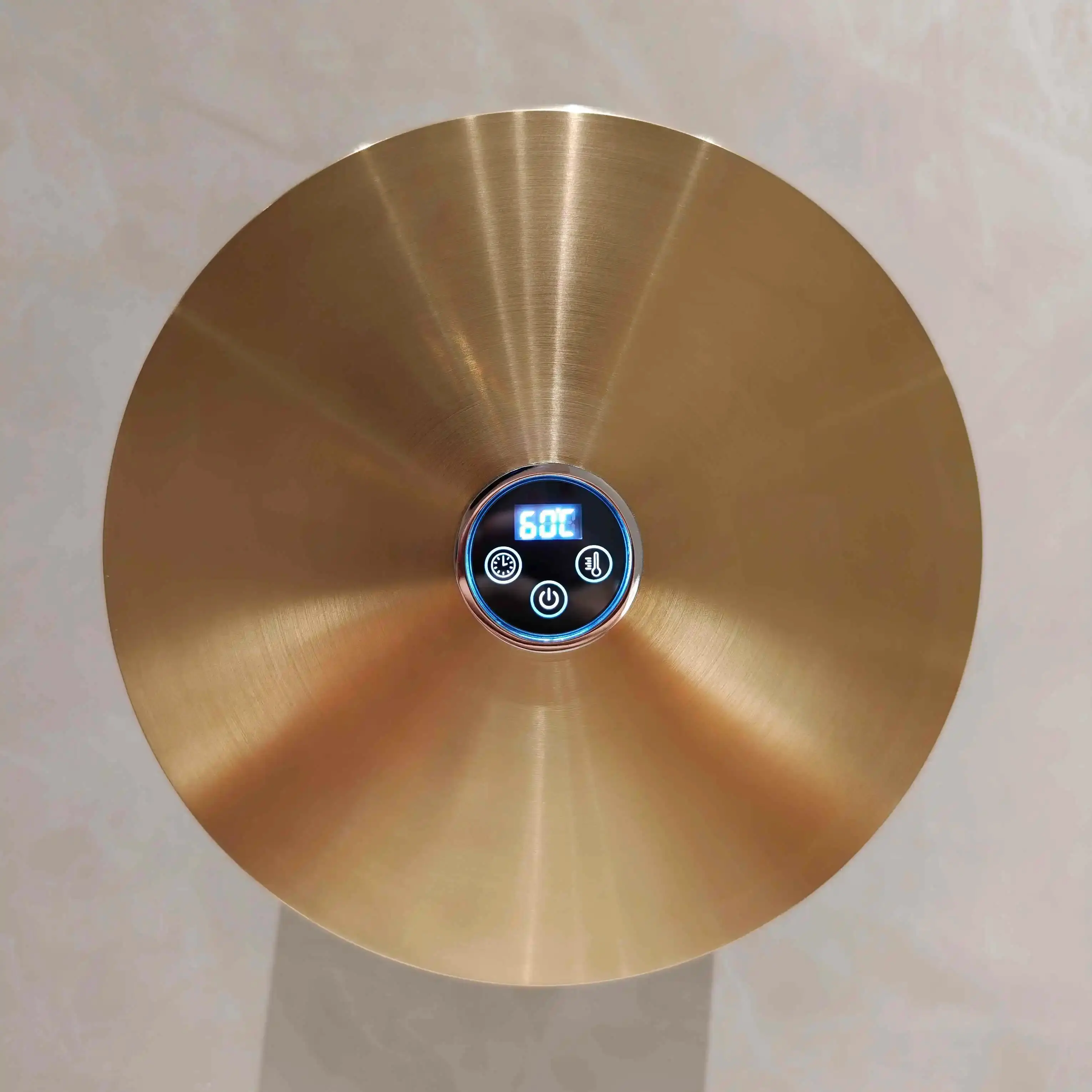 Sèche-serviettes électrique mural de forme ronde diamètre 21cm, finition doré brossé.